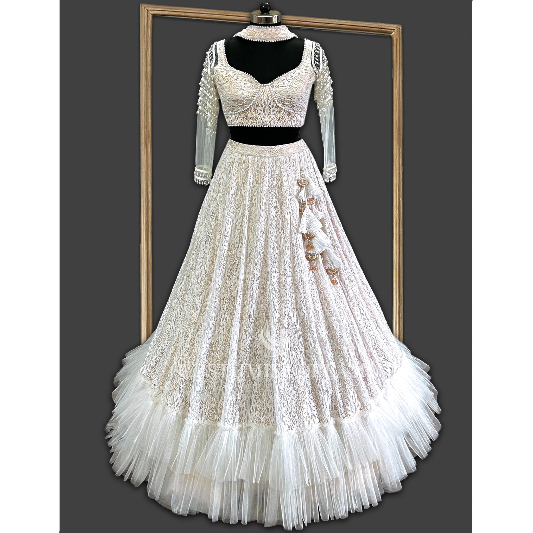 Pearl Lace Elegance: White Lehenga with Layered Frills and Nude Lining - Indian Designer Bridal Wedding Outfit